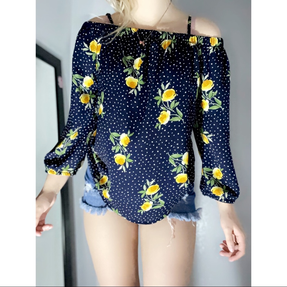 Size small sunflower and dots off the shoulder top with long sleeves.